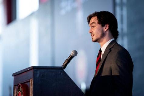 Cole Leathers, president of W&J's Student Government Association, stands at a podium.